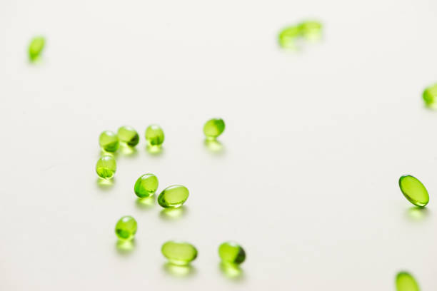 istock Top view many gel capsules on white background isolated. Vitamin E 200 mg capsules. 981527700