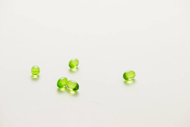 istock Top view many gel capsules on white background isolated. Vitamin E 200 mg capsules. 981527704