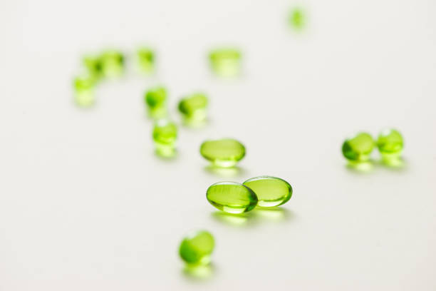istock Top view many gel capsules on white background isolated. Vitamin E 200 mg capsules. 981527762