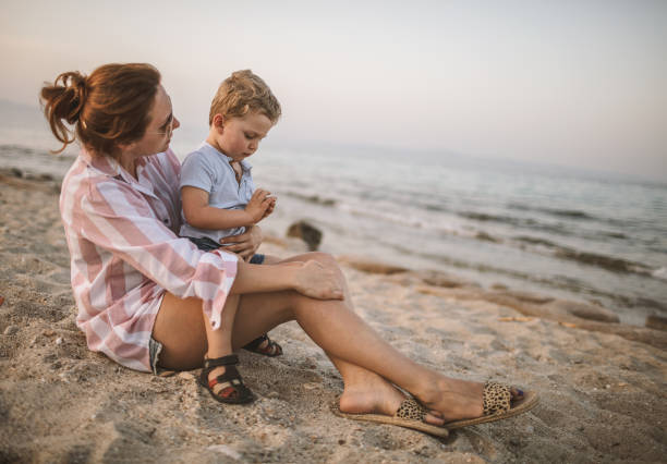 istock Mother and son at the beach 981530260