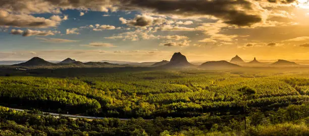 Photo of Panoramic view of Glass House Mountains at sunset visible from W