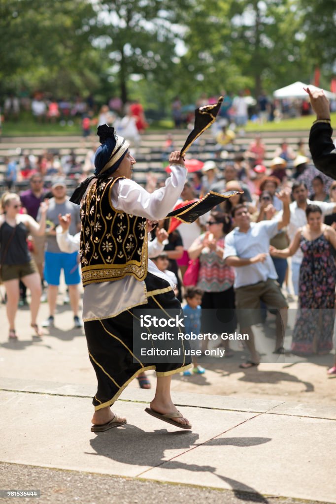 Columbus Asian Festival Columbus, Ohio, USA - May 27, 2018  A group of Bhangra dancers perform at the Asian Festival and the public join them in the dancing at the Franklin Park in Columbus, Ohio. Asian Culture Stock Photo