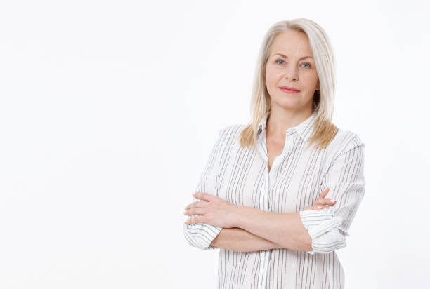 istock Friendly smiling middle-aged woman isolated on white background 981538136
