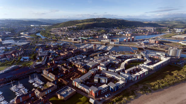 Swansea City, River Tawe, Kilvey Hill Editorial SWANSEA, UK - JUNE 20, 2018: An aerial view of the East side of Swansea City showing the new development around the Prince of Wales Dock, also the River Tawe, Swansea marina, St Thomas, Port Tennant and Kilvey Hill swansea stock pictures, royalty-free photos & images