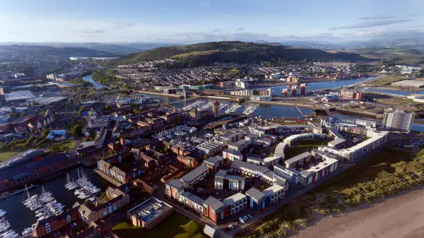 Editorial SWANSEA, UK - JUNE 20, 2018: An aerial view of the East side of Swansea City showing the new development around the Prince of Wales Dock, also the River Tawe, Swansea marina, St Thomas, Port Tennant and Kilvey Hill