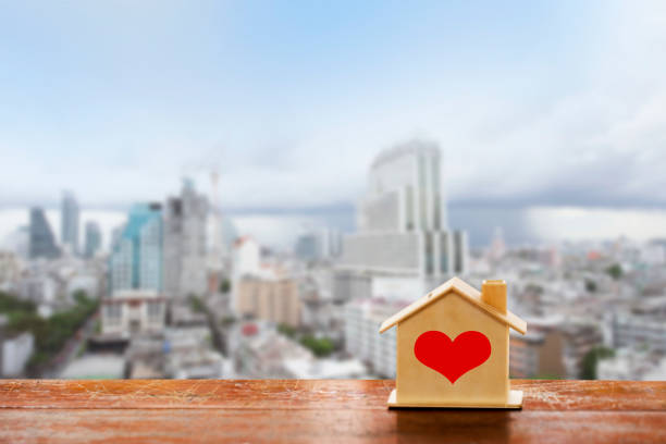 istock miniature house on wooden mock up 981542856
