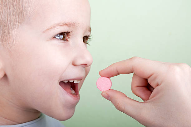 Child pill stock photo