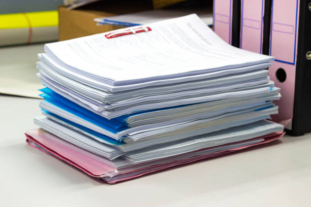 istock stack of papers documents on file cabinet in Office at offices 981581534