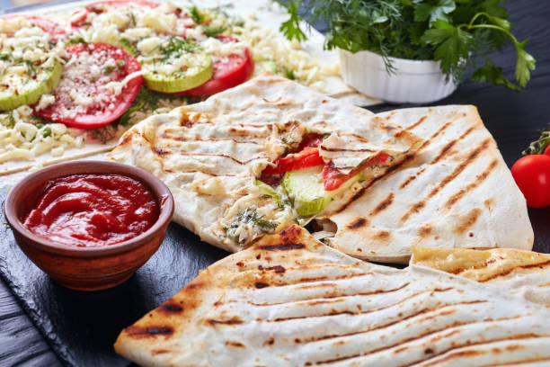 istock grilled flatbread stuffed with veggies and cheese 981582184