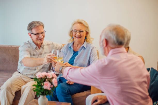 istock Seniors having celebratory toast at home 981586290