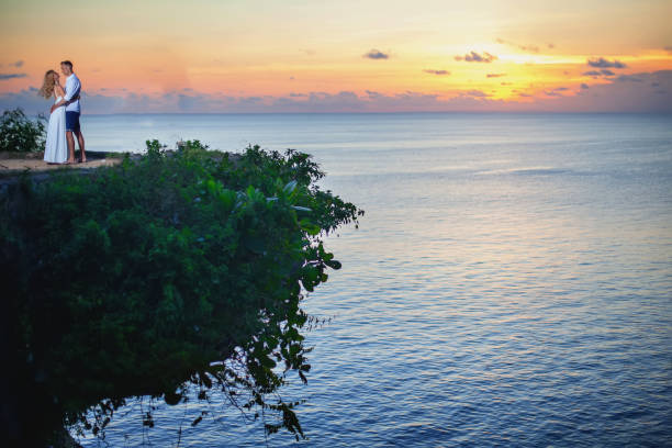 Aerial View Image By Drone Happy Couple At The Cliff In Thailand. Honeymoon Summer Travel