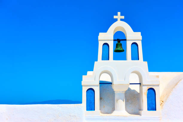 istock Small white bell-tower in Santorini 981595854