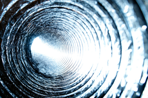 A shot from within an Air Conditioning Ducting pipe. Intentionally overexposed white light shines in from one end creating an interesting effect.