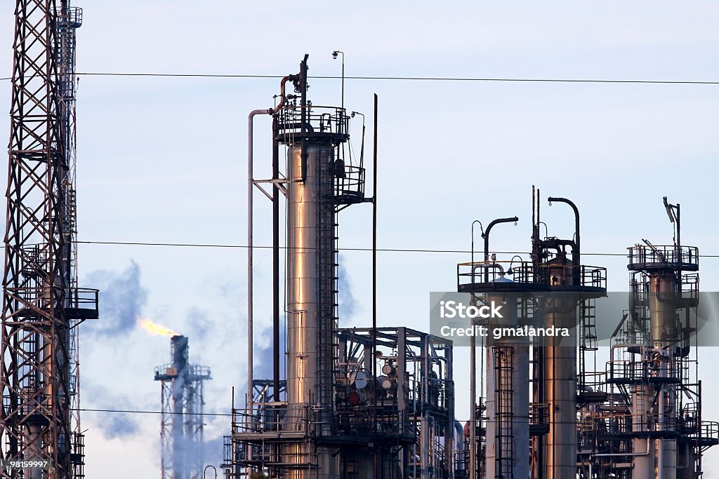Oil refinery Part of refinery complex in Italy. Flame Stock Photo