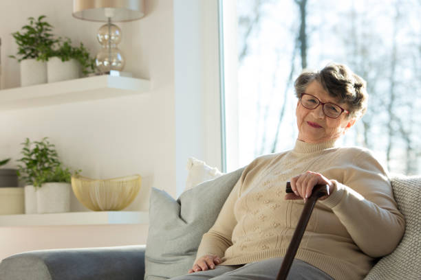 istock Senior woman with walking stick 981600686