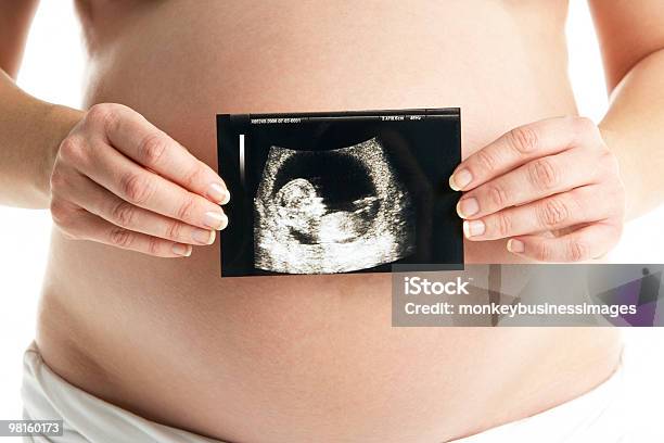 Pregnant Woman Holding Ultrasound Scan Stock Photo - Download Image Now - 20-29 Years, Adult, Adults Only