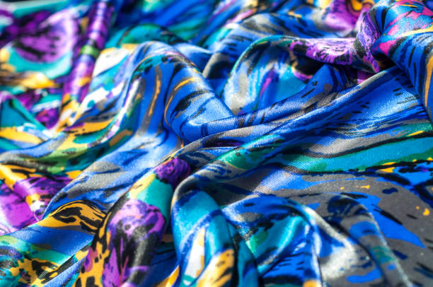 istock Texture, fabric, background. Women's scarf. Silk fabric is blue, floral pattern. Abstraction 981605742