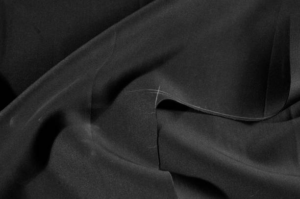 istock Texture. Background. Pattern. Black fabric for cutting clothes. Excellent evening dress, great design 981605764