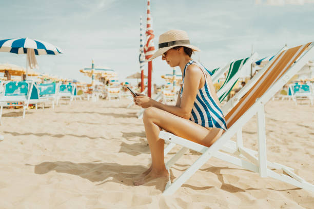 istock Young woman at italian beach 981605990