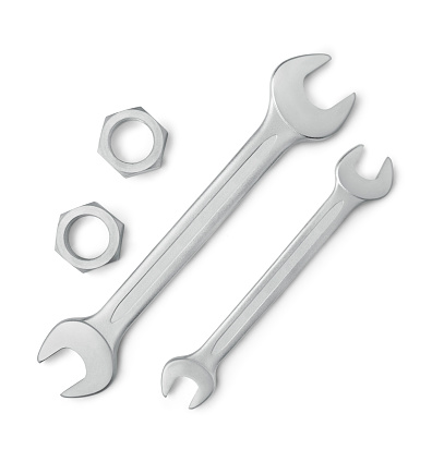 Up view of two wrenches spanner and two female screws with a soft shadow. Clipping path at the pieces