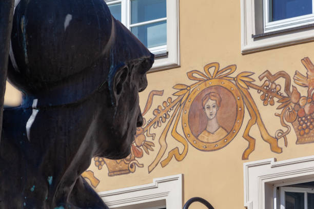 Detail of the ornate facade of a building with frescoes in the Old Market Square in Poznan, Poland
