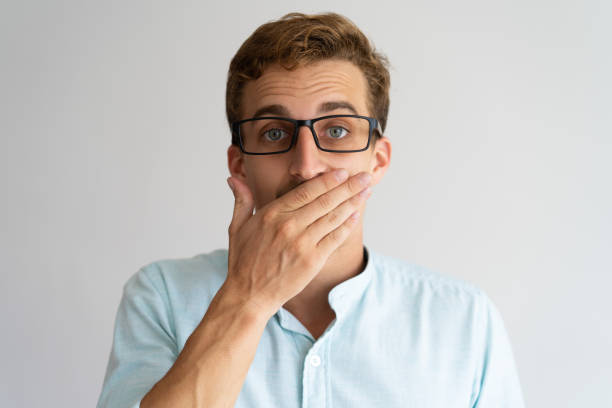 istock Surprised guy in glasses learning unexpected news 981615778