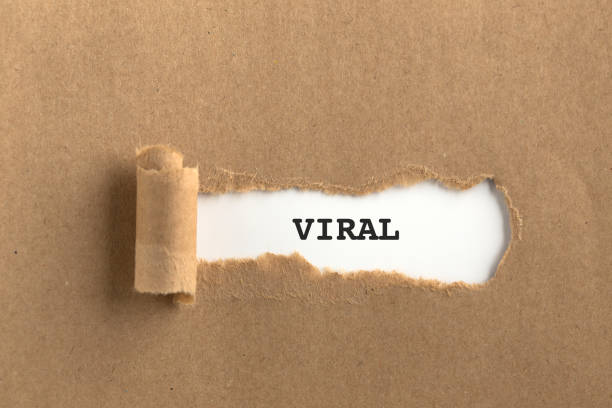istock The text VIRAL behind torn brown paper 981625960