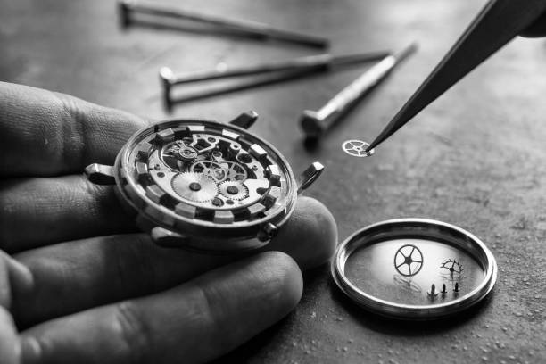 istock Process of installing a part on a mechanical watch, watch repair 981627584