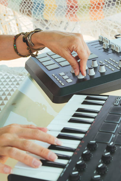 istock Hands woman DJ playing electronic music with a mixing table 981632648