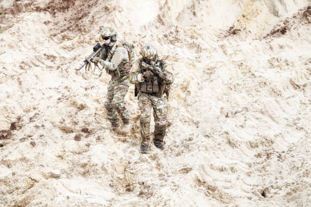 istock Infantrymen ready for fight moving in desert 981633552