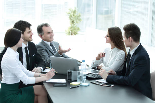 istock business colleagues talking at Desk in the office 981635766