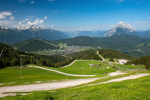 Looking down at the trails leading up Rosshütte with Seefeld and mountains beyond.