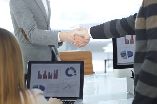 istock close up. handshake business partners in a modern office 981642702