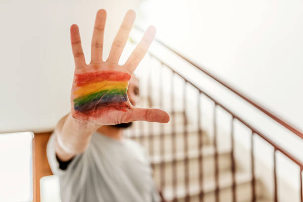 istock Man performing stop gesture with hand and flag painted in his palm 981643058