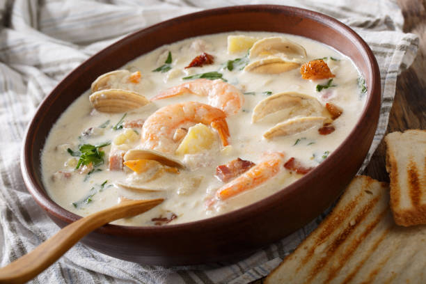 istock Delicious clam chowder soup with shellfish and bacon close-up on a in a bowl. horizontal 981645618