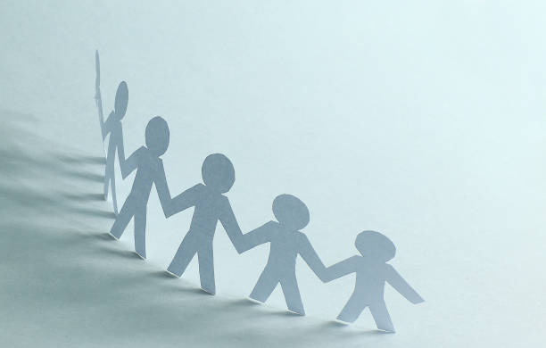 istock business background.three paper man paper background 981651120