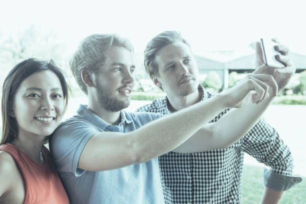 istock Smiling Asian woman spending time with friends 981654704