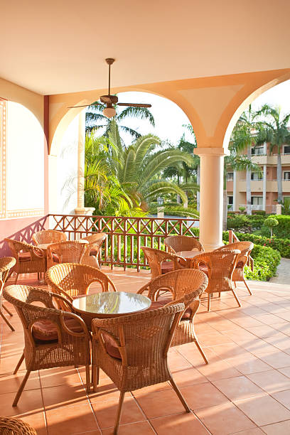 istock Brown wooden chairs an tables on patio 98165485