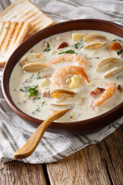 istock New England clam chowder soup close-up. vertical 981661280
