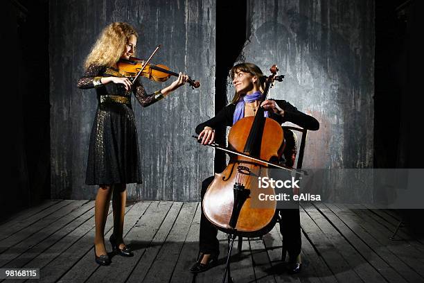 Сello And Violin Musicians Stock Photo - Download Image Now - Cello, Classical Music, Duet