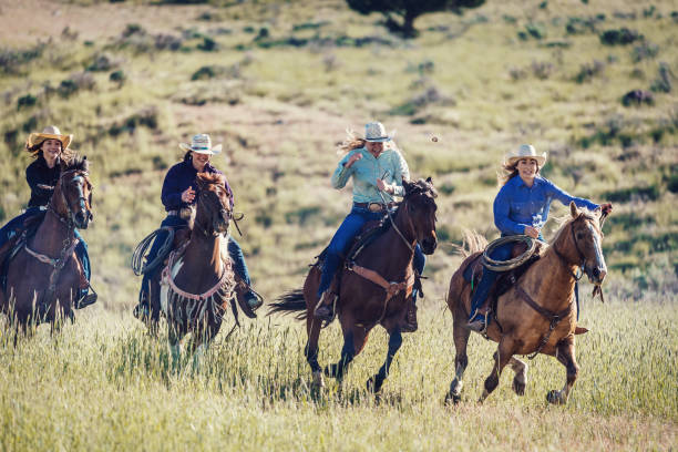 istock Galloping horses and girls 981709950