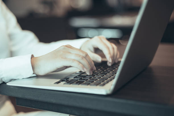 istock Businesswoman sitting in office and using laptop 981710448