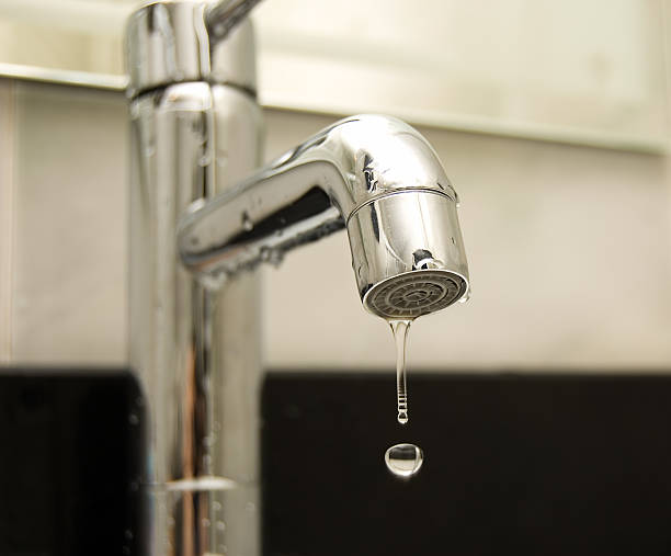 istock A silver tap with a droplet of water falling out 98173995
