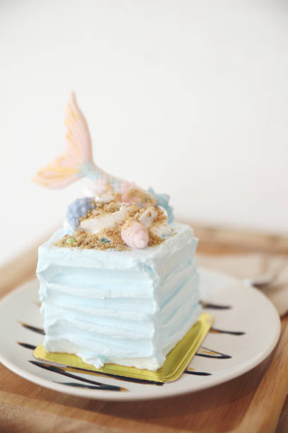 istock Fancy mermaid cake on wood background 981740446
