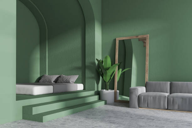 istock Corner of a cozy green bedroom 981741164