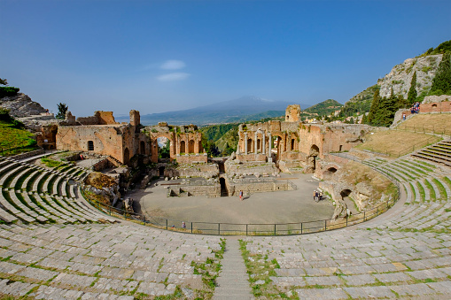 Tourists visiting the Theatre of Taormina, an ancient Greek theatre built in the 3rd century BC. It is one of the most visited tourist attractions in Sicily, and is also used as an open-air theater and for shows of various kinds.
