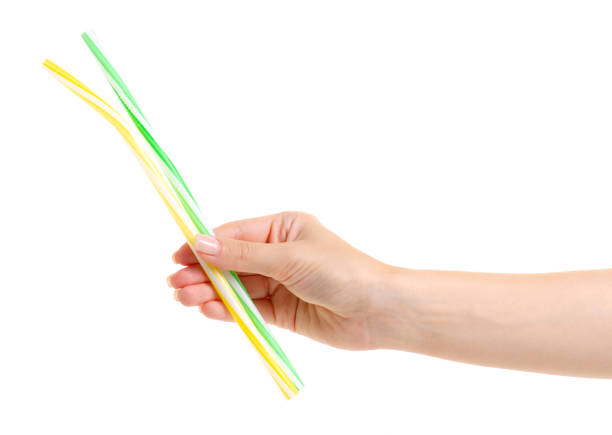 istock Cocktail tubes colorful in hand 981749982