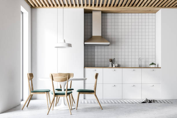 istock Interior of modern white kitchen, chairs and table 981752794
