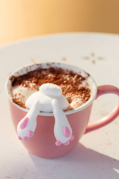 Cute bunny marshmallow in cup of coffee or cocoa. Funny food concept stock photo