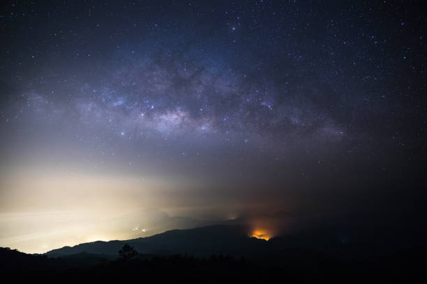 istock milky way on mountain with wildfire 981754456